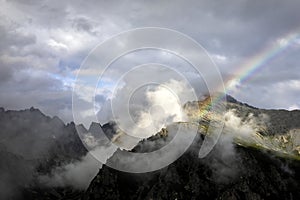 Rainbow above mountain peak