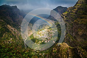 Rainbow above mountain village