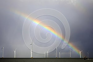 Rainbow above a offshore windpark, Holland