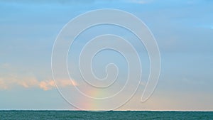 Rainbow Above The Sea. Rainbow In The Sea After Rain And Thunderstorms. Static view.