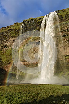 A rainbow above the waterfall in Iceland - Seljalandsfoss