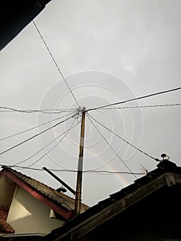 a rainbow appears in the afternoon after the rain