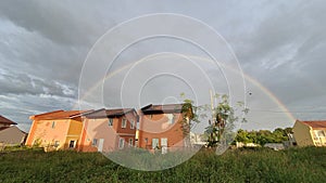 Rainbow Appears Over Housing Homes Subdivision