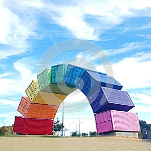 Rainbow arch of sea containers against a blue sky in Fremantle, Western Australi