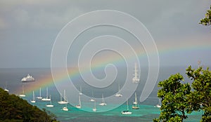 A rainbow arching over a bay in the caribbean