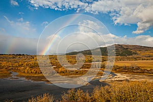 Rainbow on an autumn day near Saint Mary, Glacier National Park,