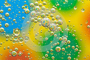 Rainbow background with bubbles, water drops texture, abstract multicolor circles pattern, creative art design, colorful liquid