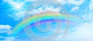 Rainbow background and sky with white clouds