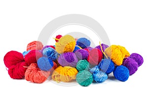 Rainbow balls of wool thread isolated on white background