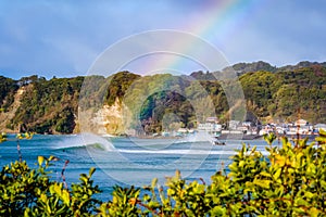 The end of a rainbow on a perfect wave landscape in Katsuura , chiba , Japan