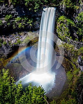 Rainbow at the base of Brandywine Falls at the Sea to Sky Highway between Squamish and Whistler