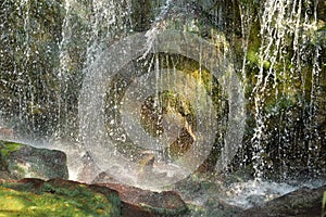 Rainbow at the base of the waterfall