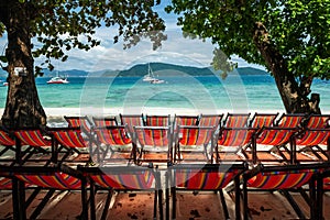 Rainbow beach deckchairs at Hey island, Phuket, Thailand