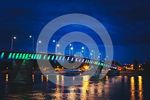 Rainbow bridge by night on Danube river between the Petrovaradin and city of Novi Sad in Serbia at night