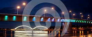 Rainbow bridge by night on Danube river between the Petrovaradin and city of Novi Sad in Serbia at night