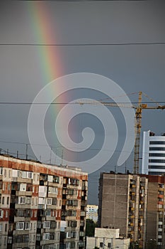 Rainbow and building under construction