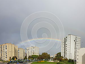 rainbow between buildings in the urbanized area in Olivais Lisbon