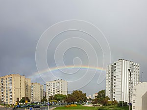 rainbow between buildings in the urbanized area in Olivais Lisbon photo