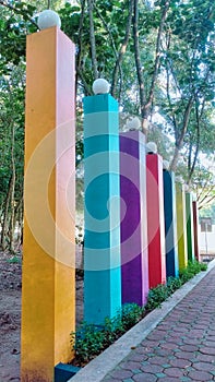 Rainbow bulidings with green forest and blue sky