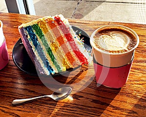 Rainbow Cake with Sprinkles, Cappucino, Spoon in Sunlight