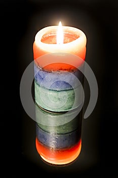 The rainbow candle and the reflection