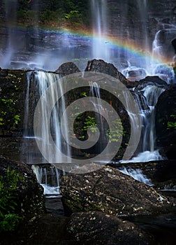 Rainbow among the cascading waterfallsat Wentworth Falls