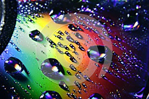 Rainbow on the CD with water drops