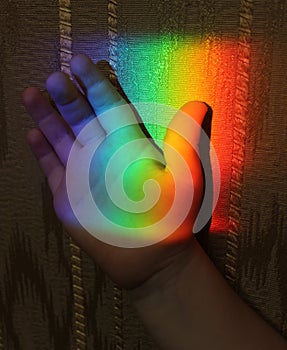 Rainbow on the child hand