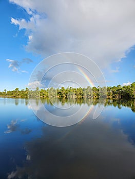 Rainbow and clouds over Pine Glades Lake in Everglades National Park. photo