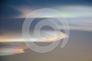 Rainbow clouds during sunset, also known as iridescent clouds