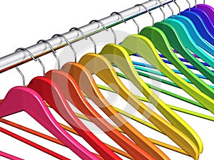 Rainbow coat hangers on clothes rail