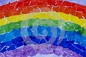 Rainbow collage made of torn paper. Mosaic of colored rainbow from gouache-colored papers. Flash mob community community for