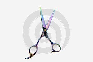 Rainbow color barber scissors isolated on white backgroud