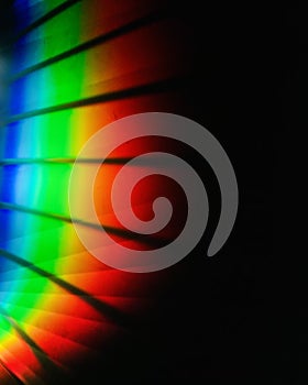 Rainbow color and black background. Vertical photo image.