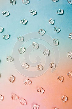Rainbow colored background with arranged glass stones