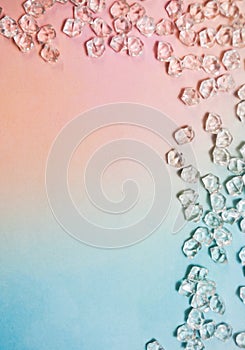 Rainbow-colored background with glass stones arranged in a frame photo