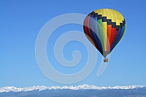 Rainbow Colored Balloon Over the Rockies