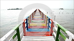 Rainbow Colored Boardwalk Bridge on Thailand Bay in Samut Sakorn Province, Thailand