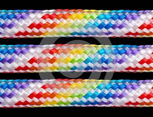 Rainbow colored braided cords isolated on black