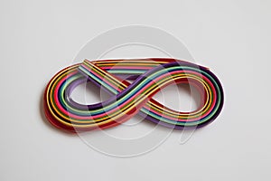 Rainbow colored quilling paper laid out in waves and shapes. Colourful Paper. A set of multi-colored paper stripes for