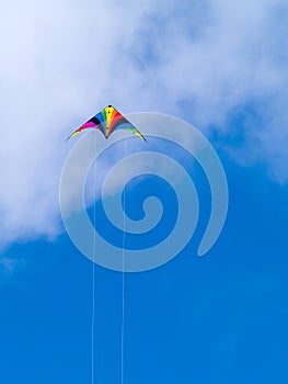 A rainbow colored stunt kite