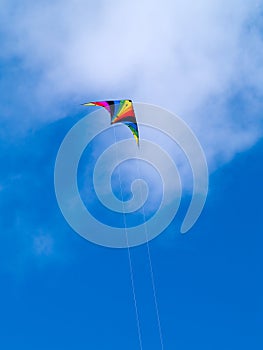 A rainbow colored stunt kite