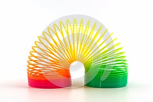 Rainbow colored wire spiral toy.