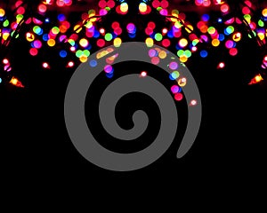 Rainbow colorful blur christmas lights background.abstract Lights unfocused blur light dots black