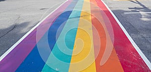 Rainbow coloured crosswalk for Pride Month on Church street in Toronto