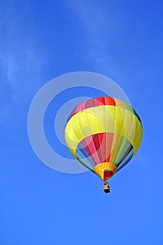 Rainbow-coloured hot-air ballon