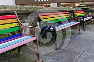 rainbow-coloured seating in a city center
