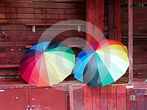 Rainbow Coloured Umbrellas For Sale on Rainy Day