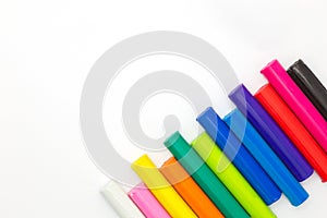 Rainbow coulor modelling clay sticks on white background