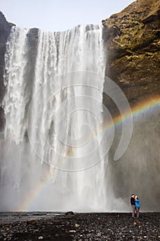 Rainbow, couple, SkÃÂ³gafoss, waterfall in south Iceland